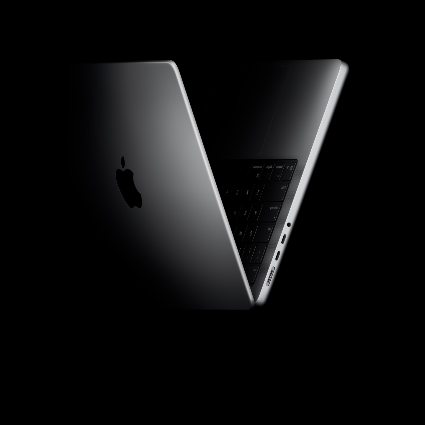 MacBook Pro positioned into the shape of a V, referencing the M5 chip